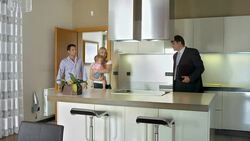 HD: Realtor Showing The features Of A Kitchen Stock Footage