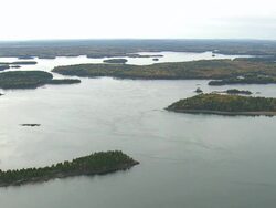 WS ARIEAL View of Wooded area with autumn color at islands / Maine, United States Stock Footage