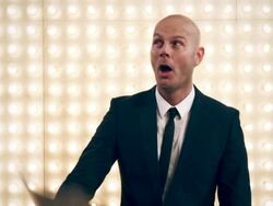 Man with contract in front of lightwall Stock Footage