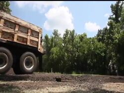 Workers use heavy equipment to build a temporary levee in Krotz Springs, La.  A key spillway along the Mississippi River will be opened Saturday, flooding Cajun country to avert a potentially bigger disaster in Baton Rouge and New Orleans. News Clip