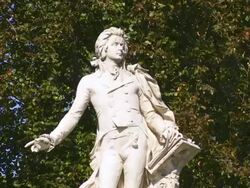MS Statue of Wolfgang Amadeus Mozart in the Burggarten (Castle Garden) in Vienna  Stock Footage