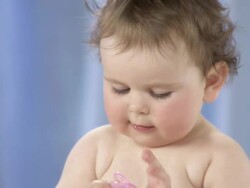 HD: Toddler Playing With A Pacifier Stock Footage