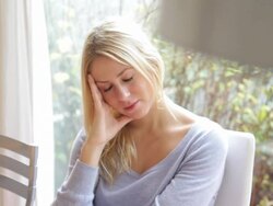Young female having a headache Stock Footage