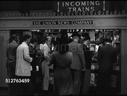 1944: NEW YORK CITY: PENN STATION: HA WS INT Pennsylvania rail station crowded w/ people. WS 'The Union News Company' Newsstand in station. Man buying book. MS Book titles. CU Book 'What To Do With Germany' by Louis Nizer. Instructional Video