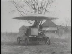 Inventors demonstrate an early, though bouncy helicopter. News Clip