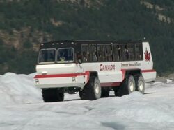 MS PAN TS ZO View of Snowcoach driving on Athabasca / Jasper, Alberta, Canada   Stock Footage