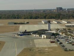 WS AERIAL View of Florence airport with control tower and car parking area / South Carolina, United States Stock Footage