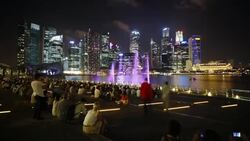 Tourists watch a light and water show in Marina Bay. Stock Footage