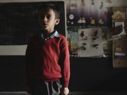 An unidentified Indian boy delivers a speech in an Indian classroom Stock Footage