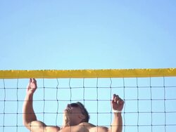 A man spiking a beach volleyball. - Slow Motion - filmed at 240 fps Stock Footage