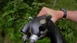 A cyclist changes gears on his bike as he rides along a path in Pennsylvania. Stock Footage