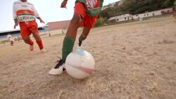 Young Brazilian soccer player dodges attack and dribbles ball down field during scrimmage match Stock Footage