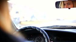 Woman driving a car Stock Footage