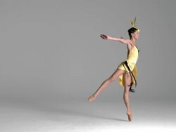slow motion of ballerina performing, dancing in yellow bird costume Stock Footage