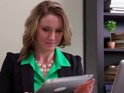 Woman in office looking at tablet Stock Footage