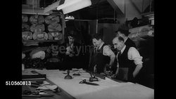 1947: LADIES' GARMENT UNION REPRESENTATIVES: DRAMATIZATION: INT MS Union Representatives entering cutting room asking workers to show union cards. VS Rep filing complaint on Manager telling workers to report to Union HQ. (SOT). NYC ILGWU Instructional Video