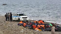 Syrian migrants fleeing the war and escaping to Europe, landing on the Greek island of Lesvos on the north coast at Efthalou. Up to 4,000 migrants a day are landing on the island and overwhelming the authorities. They are traficked by illegal Turkish peopl Stock Footage