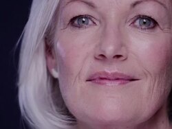 CU senior woman looking and smiling to camera Stock Footage