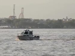 A police boat travels up the Hudson River Stock Footage