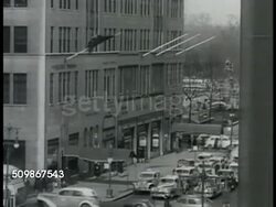 1948: NEW YORK CITY: MIDTOWN EAST:  XHA (looking northwest) WS Fifth Avenue w/ taxi cabs moving downtown, Grand Army Plaza just beyond large block long building. Instructional Video