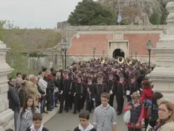 MS Red band crossing bridge on easter parade AUDIO / Kerkyra, Corfu, Greece Stock Footage