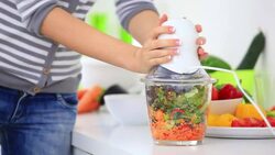 Preparing vegetables with blender Stock Footage