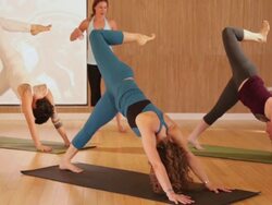 WS Yoga instructor leading class through various yoga poses / Austin, Texas, USA Stock Footage