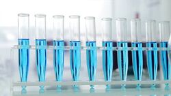 Beakers and test tubes on table Stock Footage