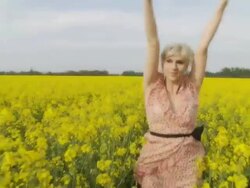 HD SLOW MOTION: Woman Running Through Field With Arms Raised Stock Footage