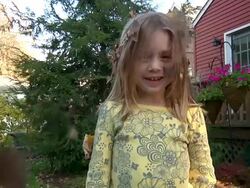 Leaves falling on little girls head 001 720p30 Stock Footage