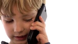 Little Boy On Cell Phone Stock Footage
