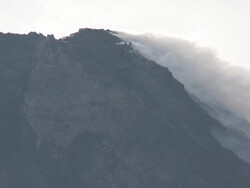 Steam and gas rise from lava dome at Merapi volcano; Central Java, Indonesia. 29 October 2010 Stock Footage
