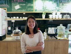 WS Young woman smiling in a cafe. Stock Footage