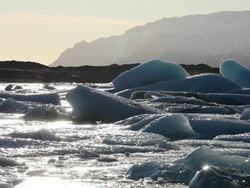 MS Sunset illuminate glacier and lake / Iceland Stock Footage
