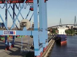 WS View of container ship for container terminal with Kohlbrand Bridge in harbour / Hamburg, Germany Stock Footage