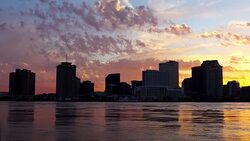 Downtown New Orleans Louisiana skyline along the Mississippi River Stock Footage