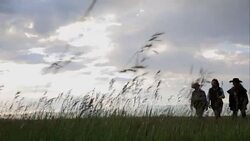 Female ranchers walking in remote rural field Stock Footage