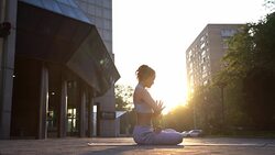 Young Woman Doing Yoga Meditation Exercises at Sunset Stock Footage