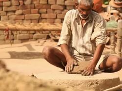 Potter kneading clay, Faridabad, Haryana, India Stock Footage