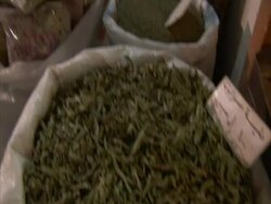 Tilt up from bag of herbs to bags of lavender in market stall, Egypt (sound available) Stock Footage