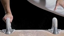 SLO MO Hands of gymnast performing on pommel horse Stock Footage