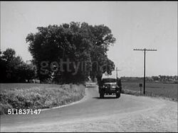 1947: STANDARD OIL (INDIANA): SALESMEN: LS Tank wagon driving down rural country road. MS Salesman 'George Meyn' in uniform driving tanker w/ name under driver's window. Instructional Video
