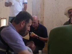 Rebel soldiers sitting around talking & eating News Clip