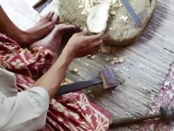 CU Shot over man carving piece of wood into mask / Ubud, Bali, Indonesia Stock Footage