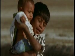 CU Gujarat, Indian boy holding baby, Gujarat, India Stock Footage