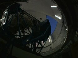 Low Angle static _ An observatory door opens, and a telescope is moved into position as light fades / Cambridge, Massachusetts, USA Stock Footage