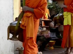 MS Buddhist Monks collecting alms in morning  AUDIO / Luang Prabang, Luang Prabang, Laos Stock Footage