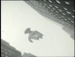 The crowd in Times Square celebrates VJ Day by holding up newspapers with the headlines, Japan Surrenders and It's Over. News Clip