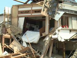 Destruction in Kesennuma City, a traditional fishing town in N E Japan filmed on 1 April 2011, 3 weeks after a tsunami which was caused by magnitude 9 Tohoku earthquake off north east Japan / AUDIO Stock Footage