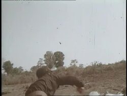 A Vietcong soldier throws a grenade. News Clip